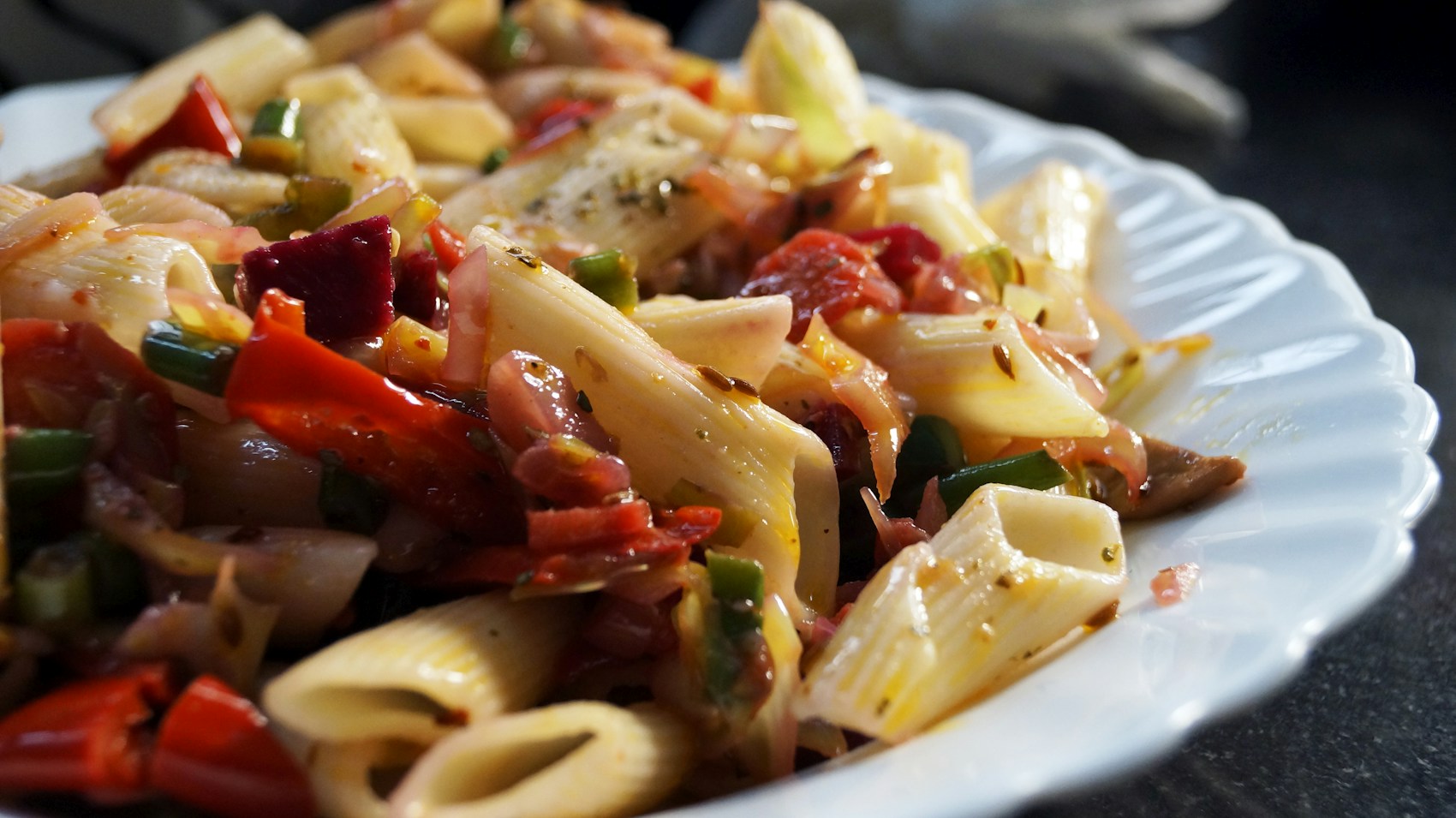 A freshly prepared pasta dish served at the table